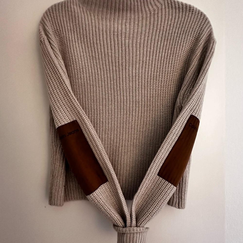 Calvin Klein cropped sweater with suede arm patches.